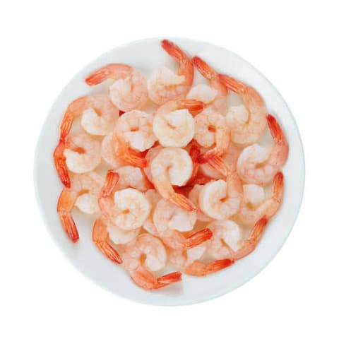 A white plate of peeled cooked prawns.
